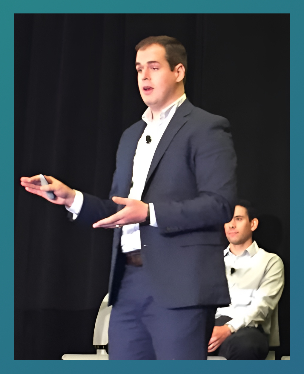 Joe Ewing presenting on stage